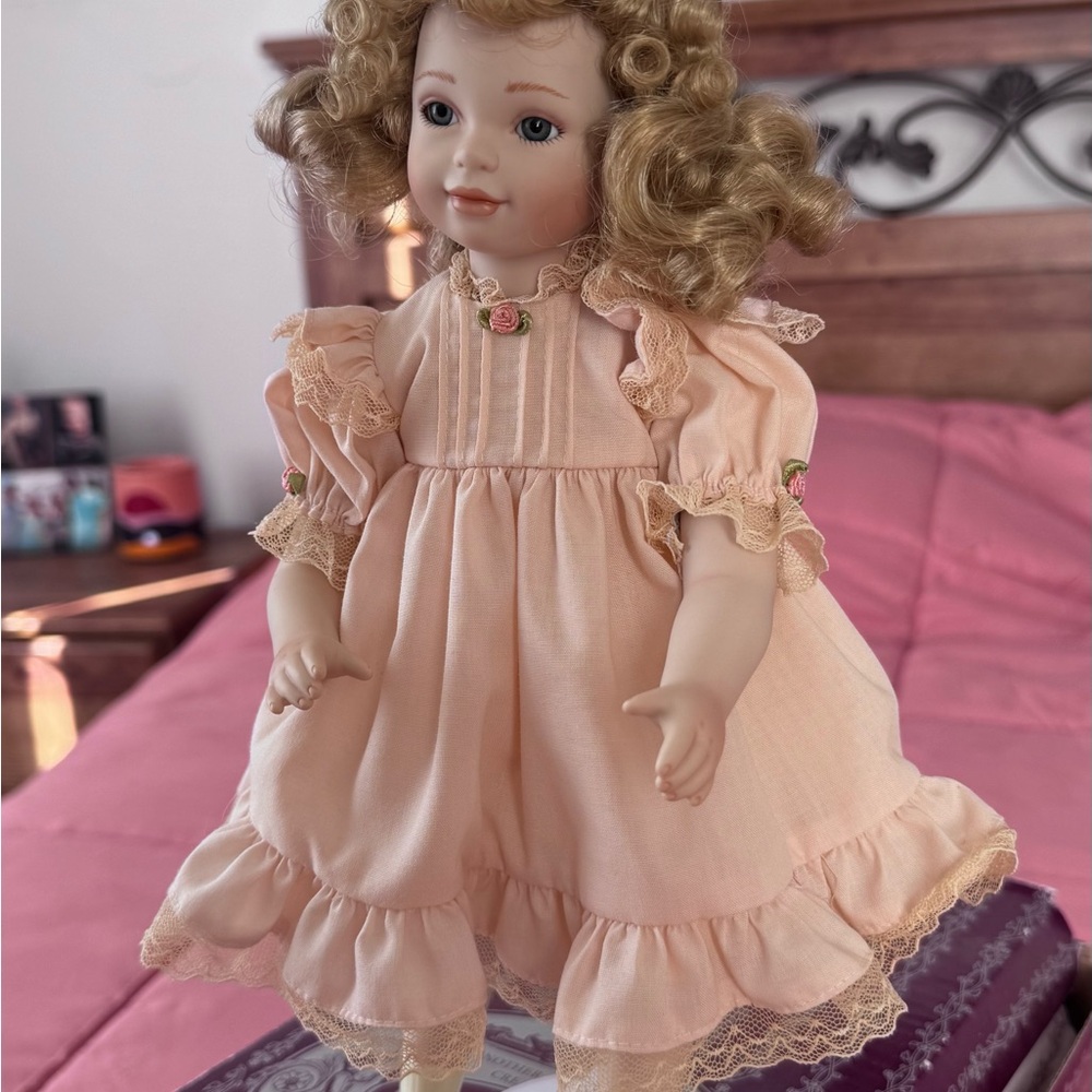 Vintage collectible Doll with curly hair and Ruffled Dress (new in box)
